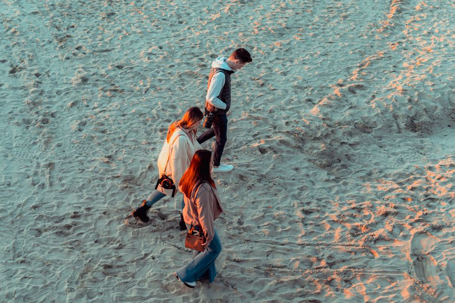 people walking on a beach