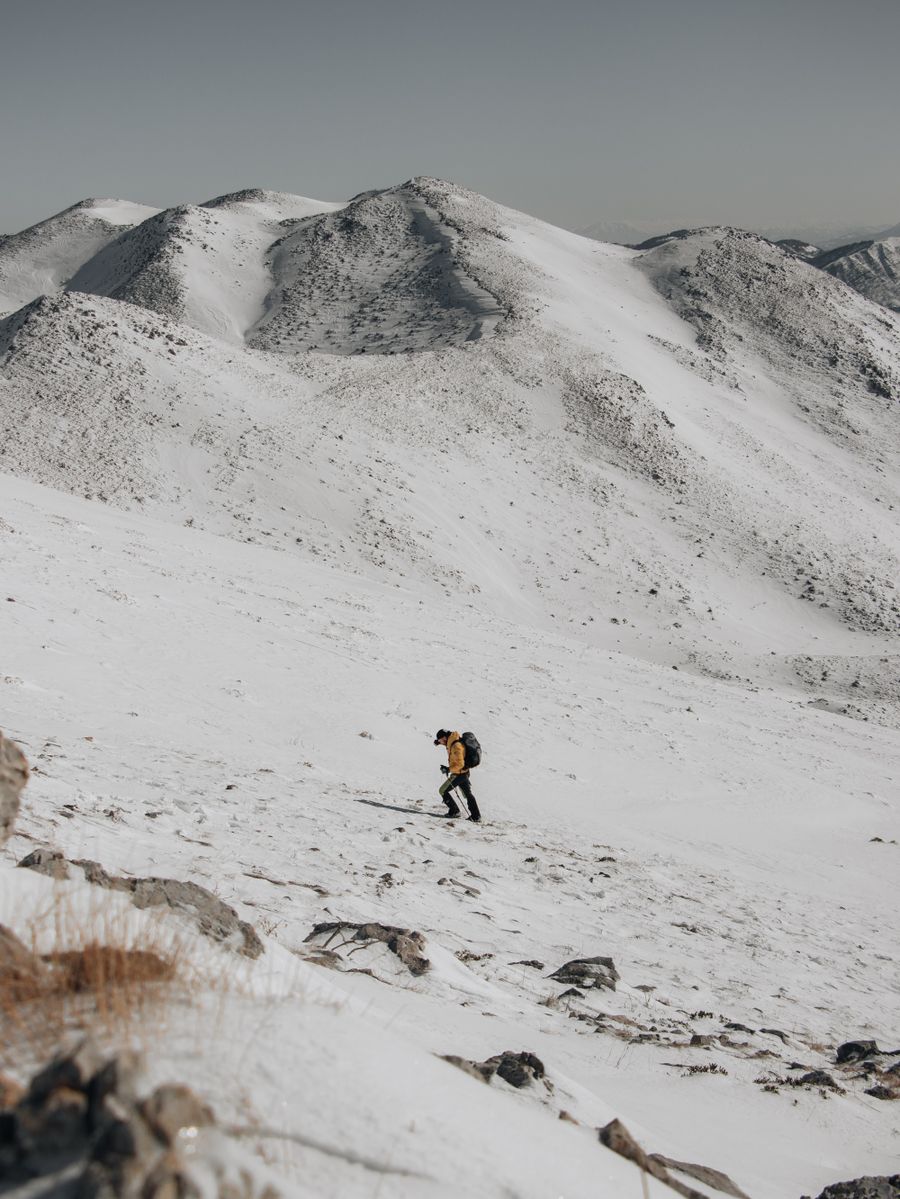 man hiking in snow in mountains — eSIM Installation Guide accepts your trip details and hands back a clear recommendation.