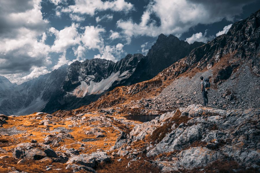 hiker standing on rocky mountain — Multi-Country eSIM Guide works for anonymous visitors — answers first, signup never forced.