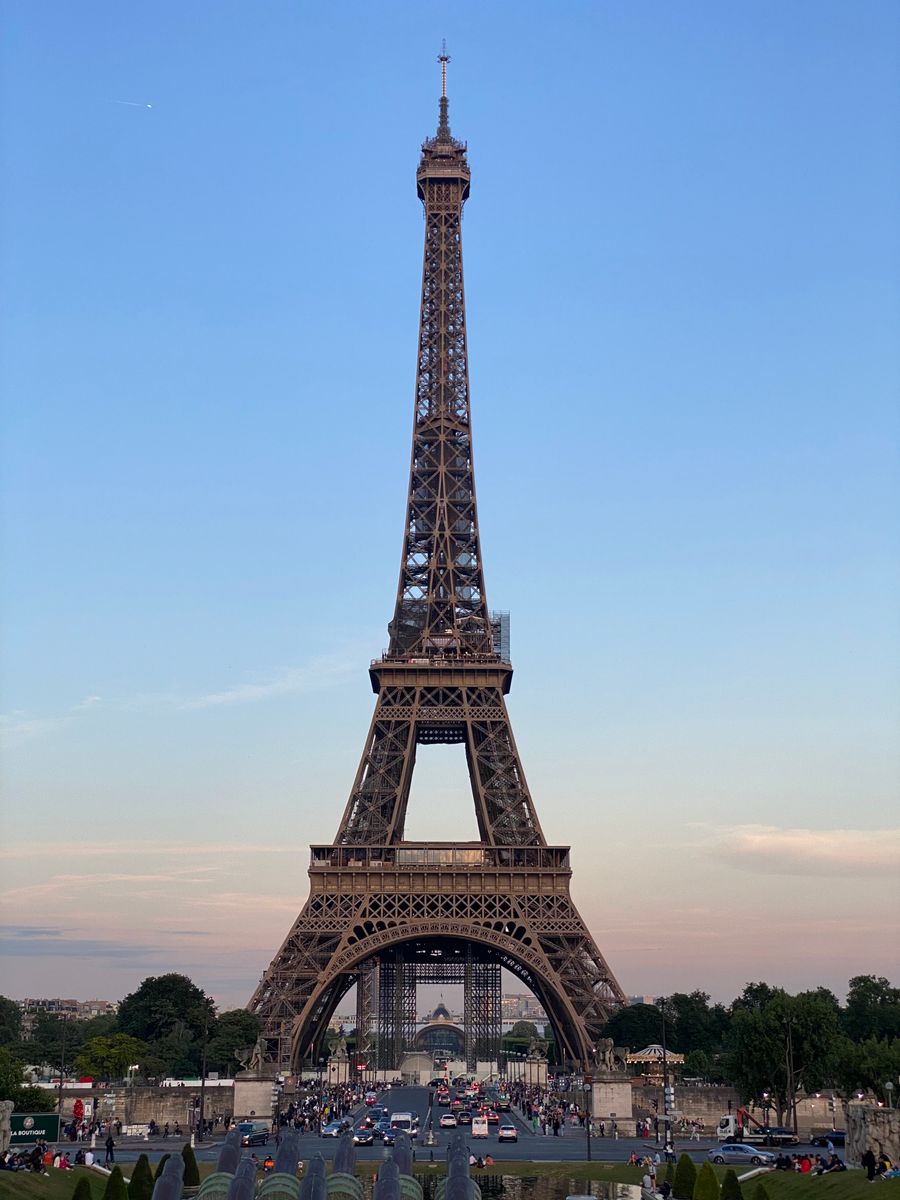 view of the eiffel tower at sunset paris france — Downtown, connected: the eSIM finds the fastest local network on its own.