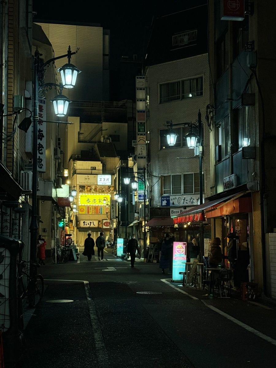 vibrant tokyo street at night with neon lights