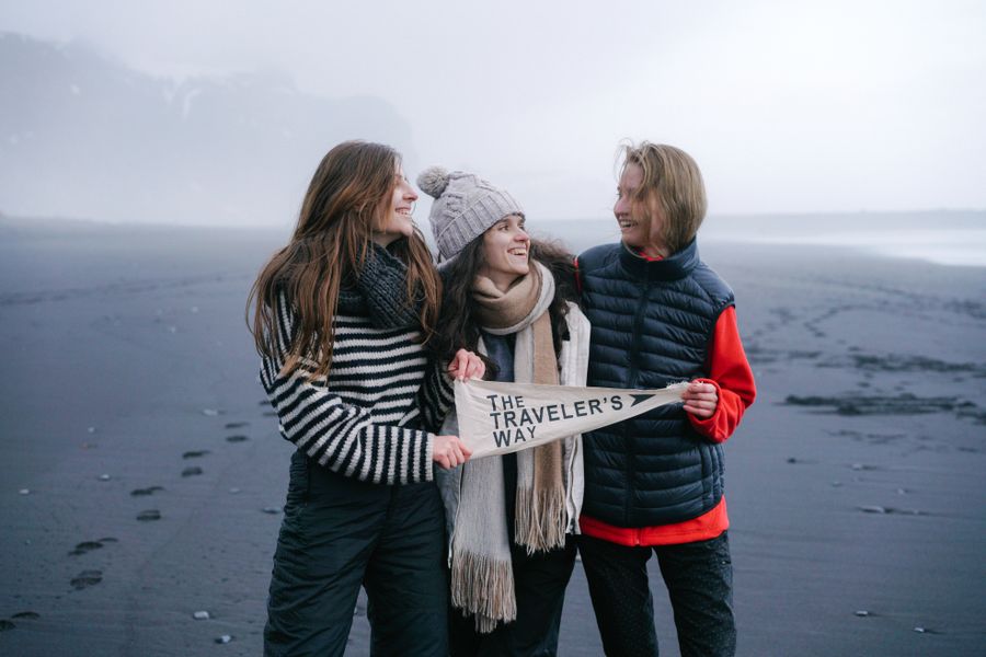 smiling women on beach in fog