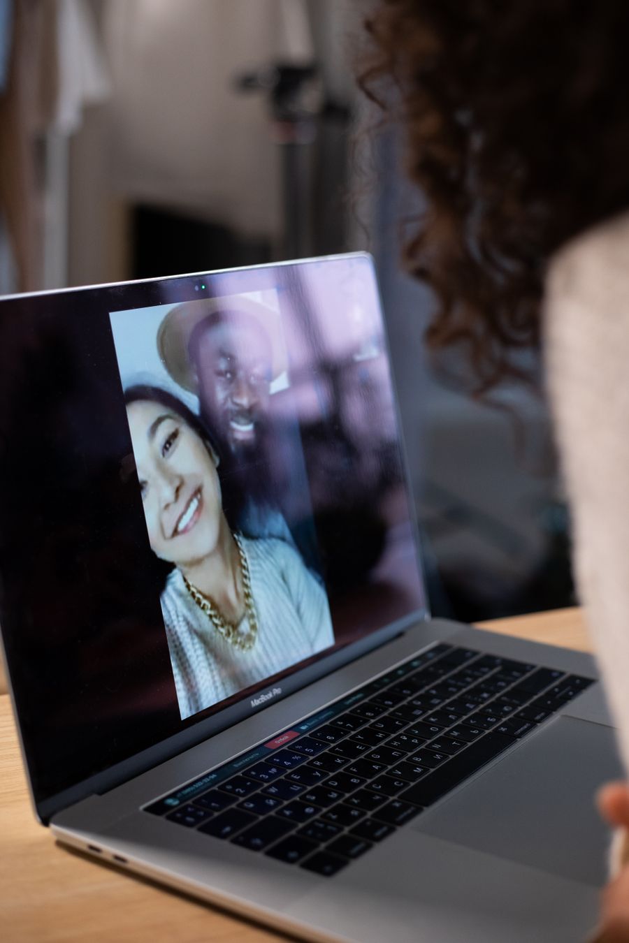 crop woman making video call on laptop — The night bus: entertainment downloaded, messages queued, rest easy.