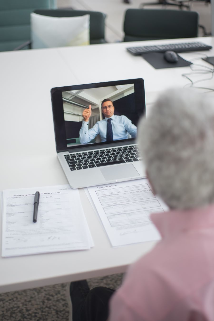 an elderly man on video call with an agent doing a hand sign — Every run of Resend eSIM QR Code is free — no credits, no paywall, no expiring trial.