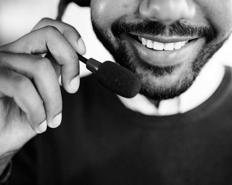 grayscale photo of person talking on headset — From How Much Speed Do You Need?'s answer to checkout is a short, well-lit path.