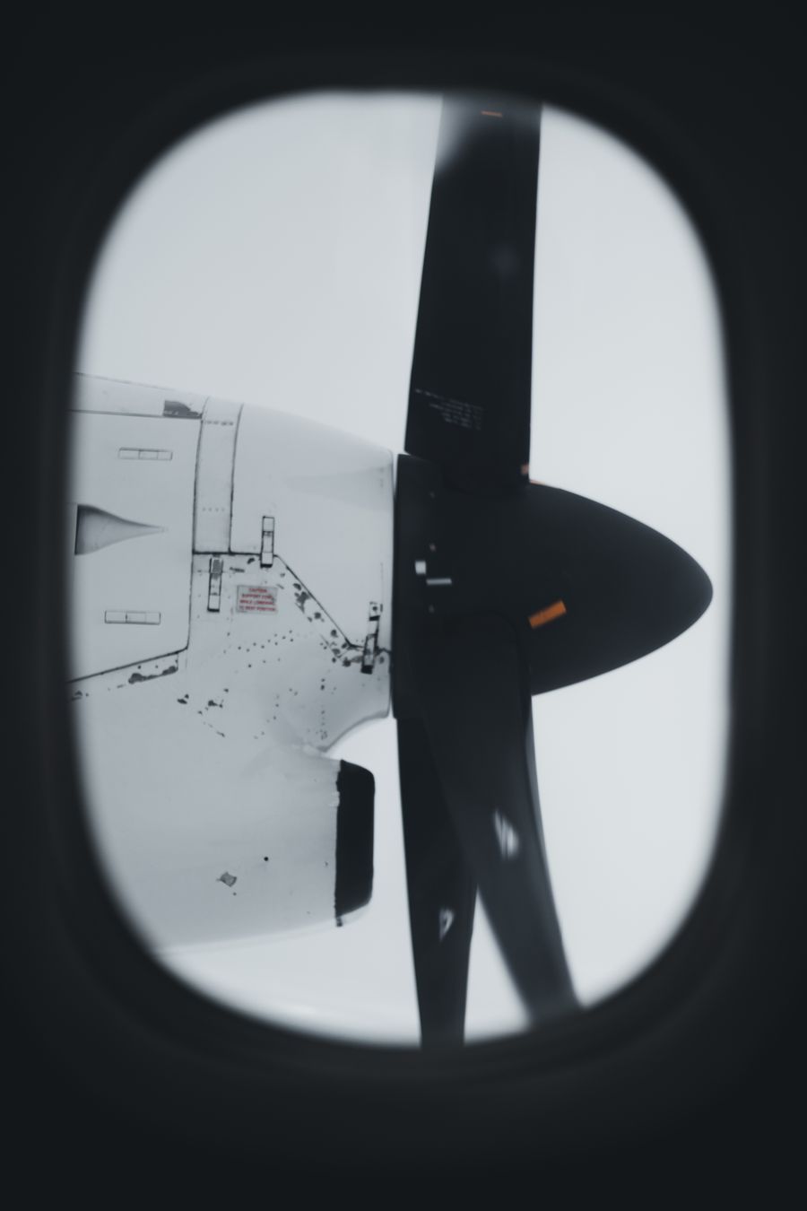 aircraft propellers through a plane window — Captive Portal Detector accepts your trip details and hands back a clear recommendation.